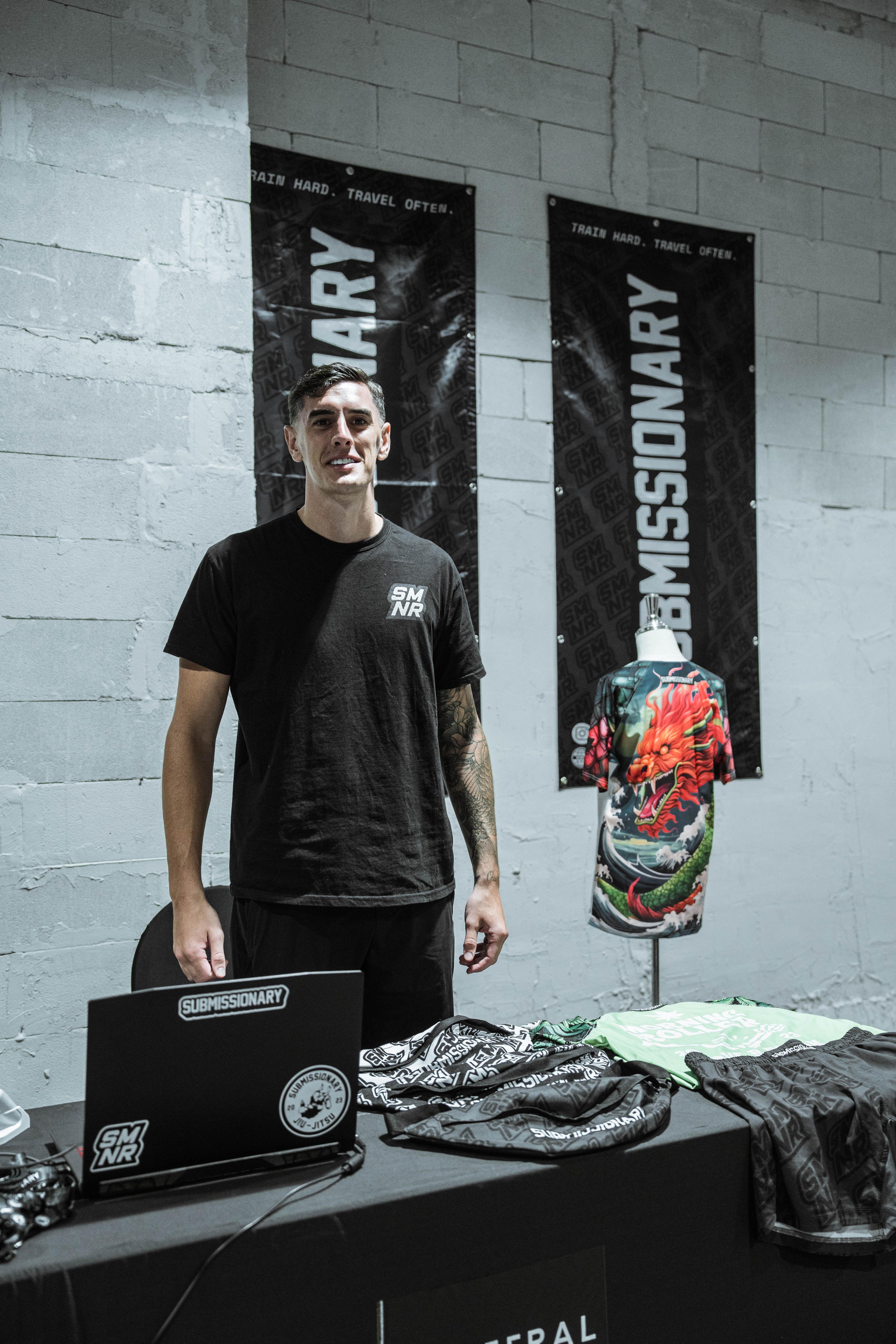 Submissionary representative at the branded event stand